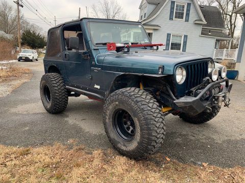 well modified 1998 Jeep Wrangler Sport offroad for sale